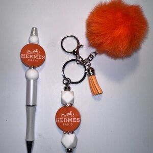 Hermès Orange and White Pen and Keychain Set